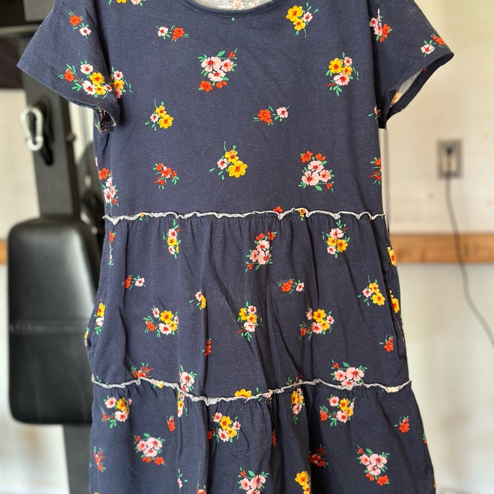 Girls old navy dress with pockets. Only worn a few times navy blue with flowers.